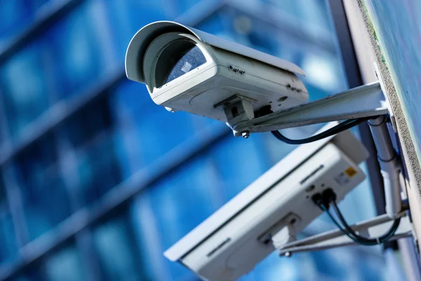 depositphotos_42356555-stock-photo-security-camera-and-urban-video